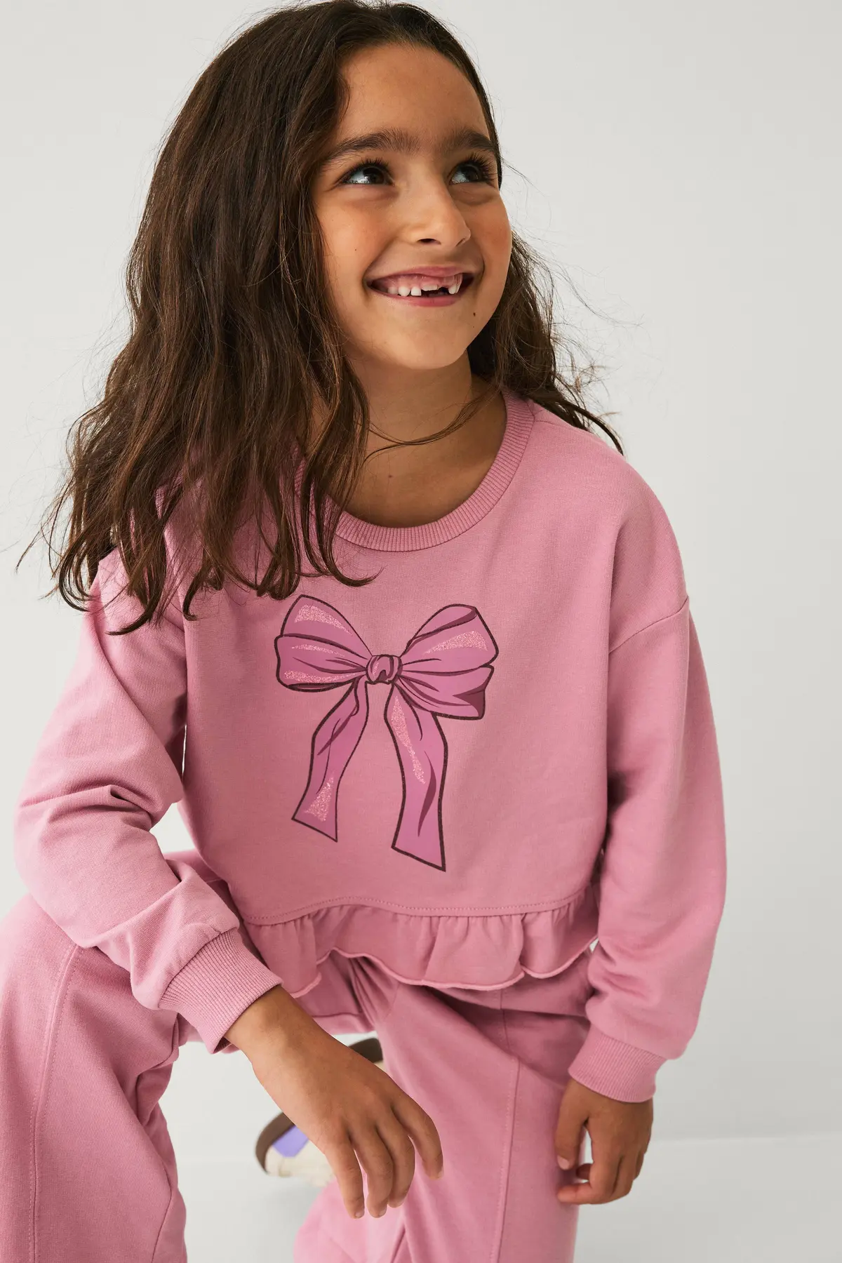 Collegegenser med volang rosa
