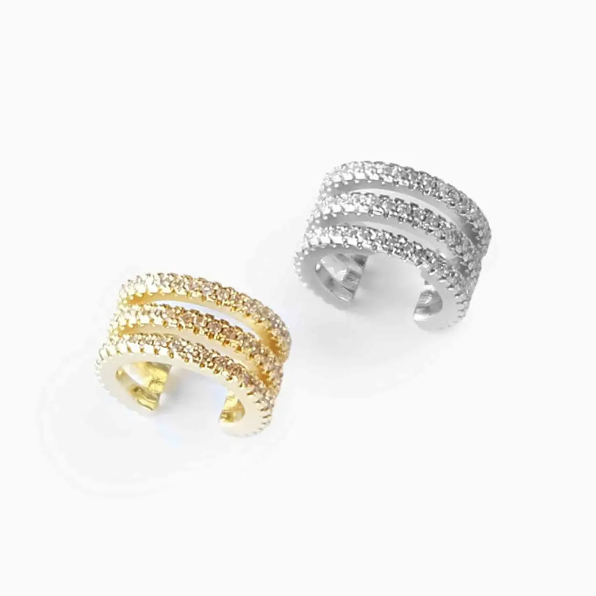 Sett med 2 ear cuffs, sølv og gull
