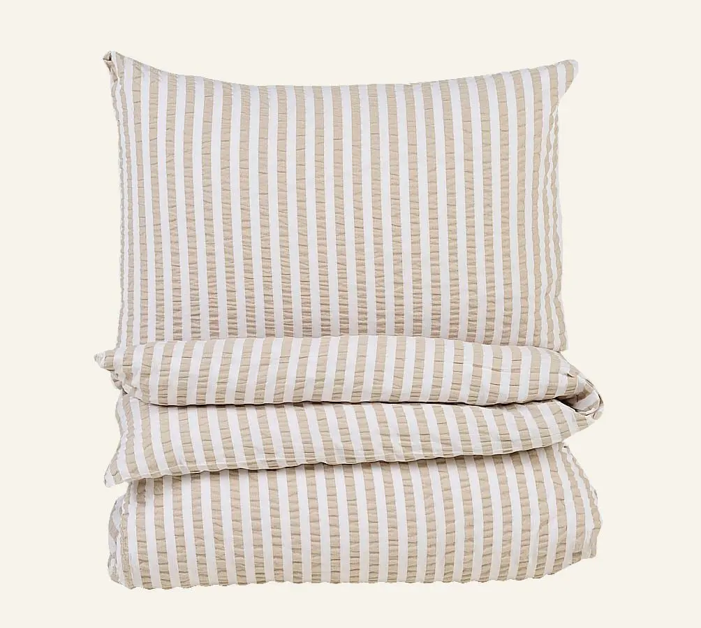 Atelier krepp sengesett sand